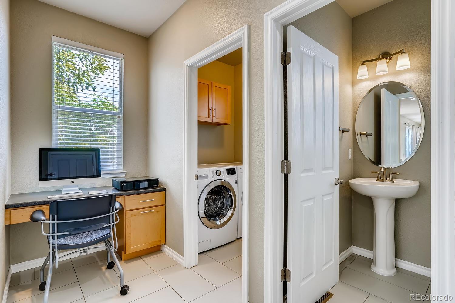 10750 Riverbrook Circle Highlands Ranch, CO 80126 - Photo 14 of 28 a view of a livingroom with washer and dryer