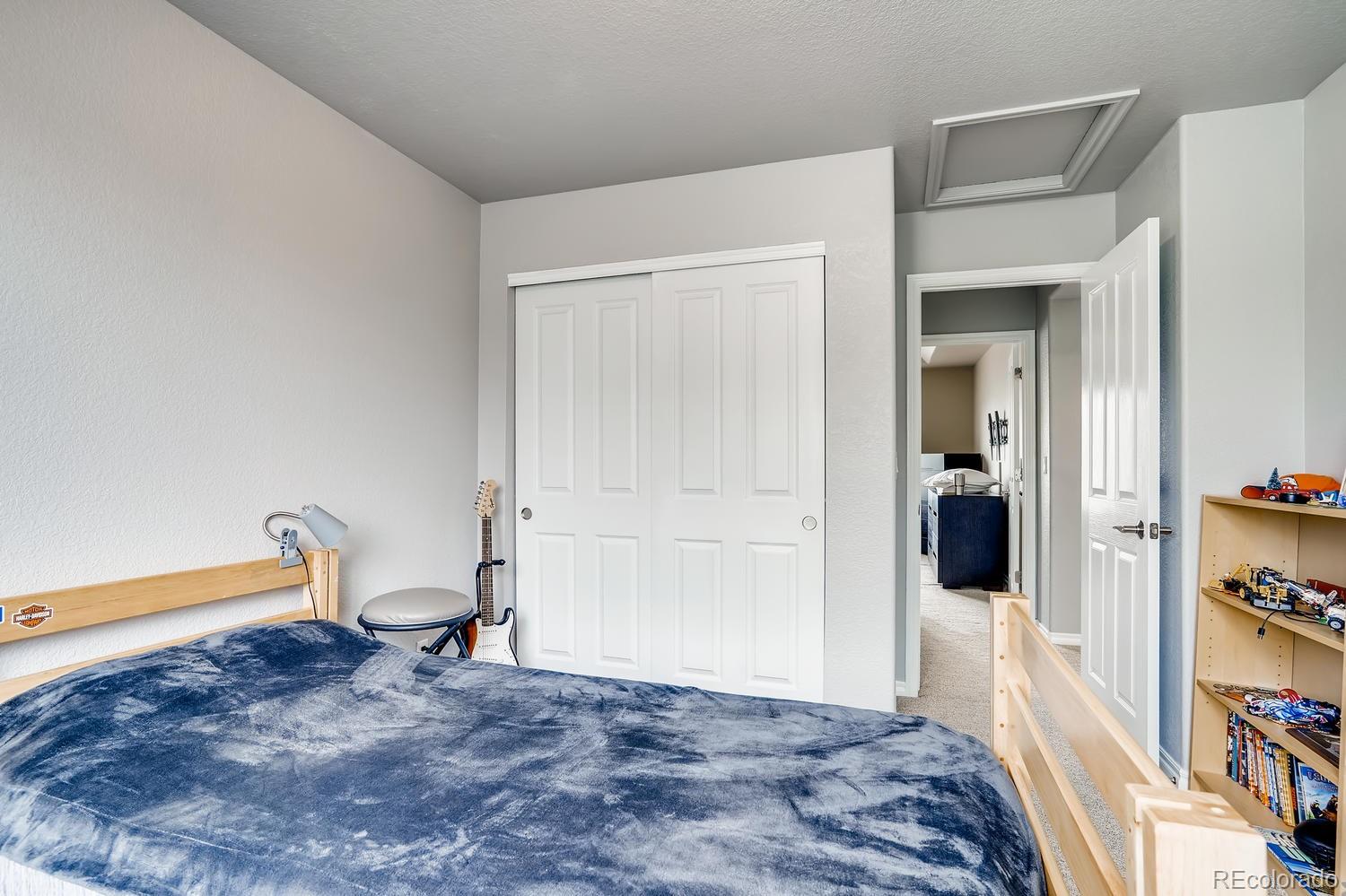 10750 Riverbrook Circle Highlands Ranch, CO 80126 - Photo 22 of 28 a view of a bedroom with a wardrobe space