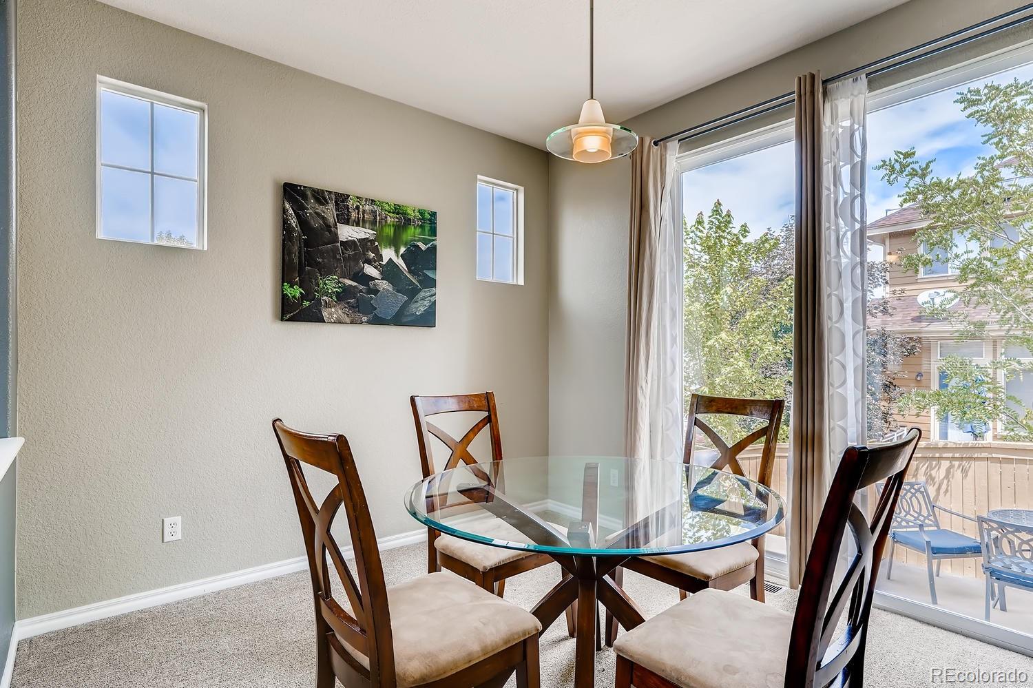 10750 Riverbrook Circle Highlands Ranch, CO 80126 - Photo 7 of 28 a view of a dining room with furniture window and outside view