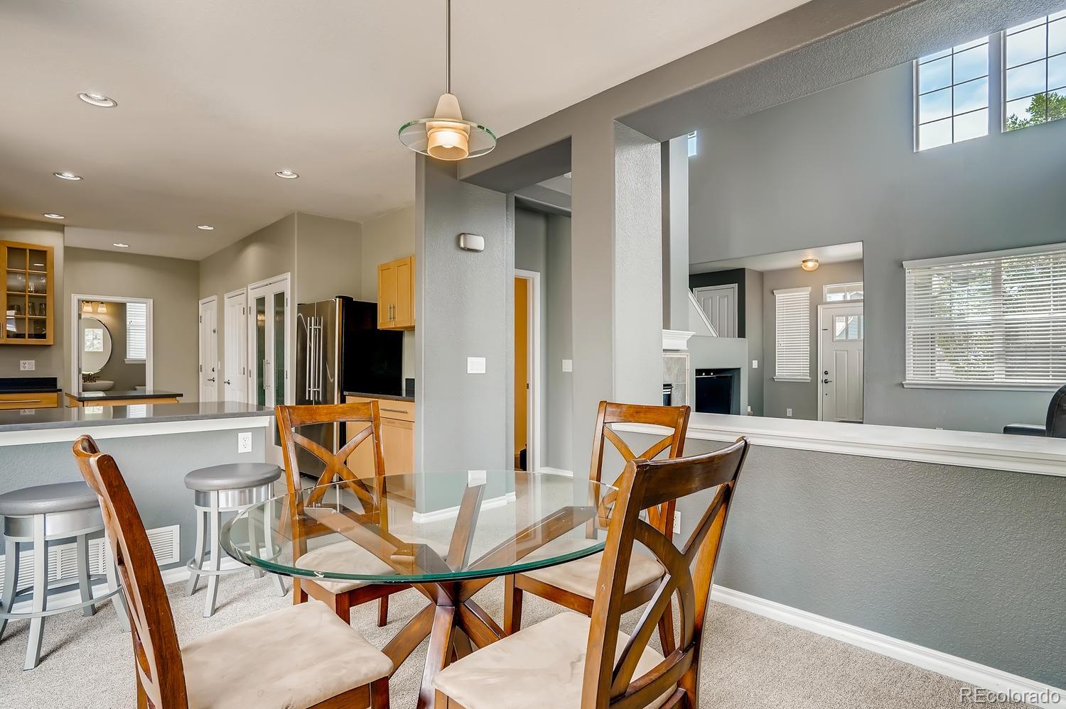 10750 Riverbrook Circle Highlands Ranch, CO 80126 - Photo 9 of 28 a dining room with furniture and window