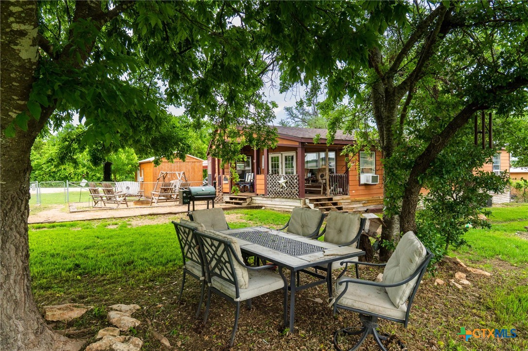 164 County Road 4450 Kempner, TX 76539 - Photo 27 of 44 a view of house with backyard outdoor seating area and green space