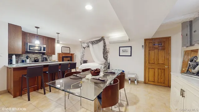 a kitchen with stainless steel appliances kitchen island granite countertop a sink and cabinets