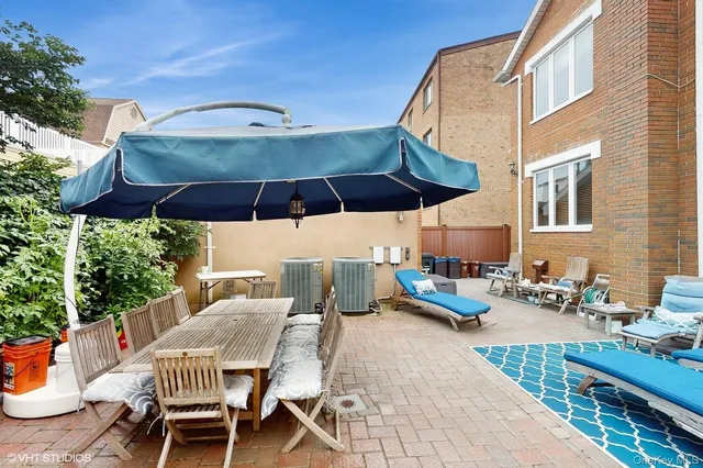 a view of a patio with furniture and stove