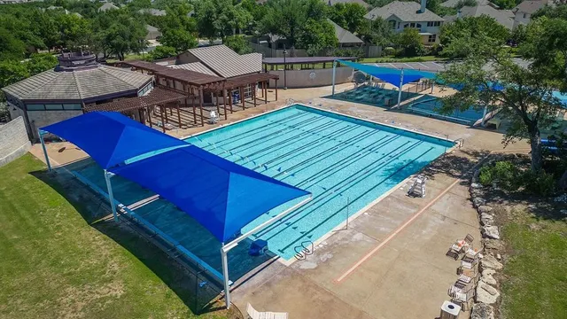an outdoor sitting area with furniture