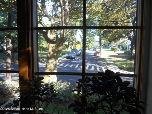 a living room with furniture a window and a fireplace