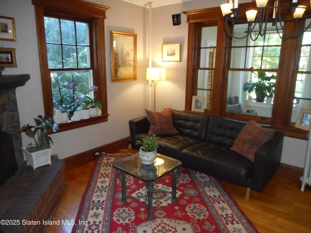 a living room with furniture and a rug