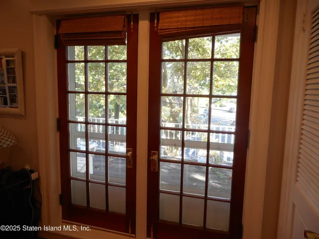 a bedroom with a bed chair and a window