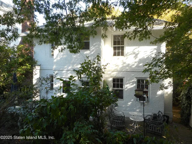 a view of a house with a tree