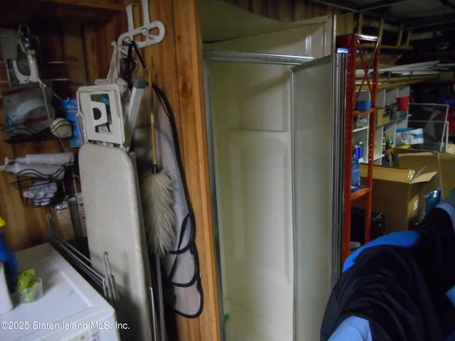 a view of storage and utility room with racks on the wall