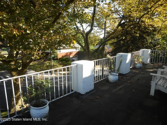 a view of a chairs and table in backyard