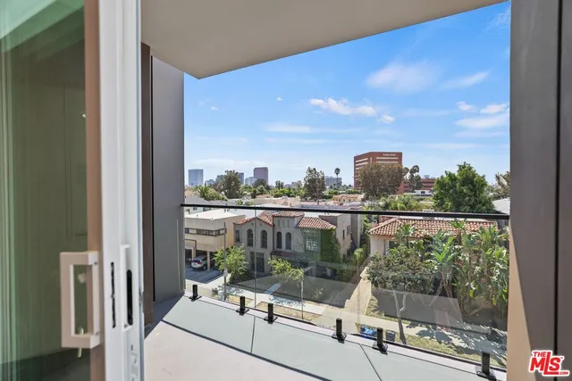 a view of swimming pool from a balcony
