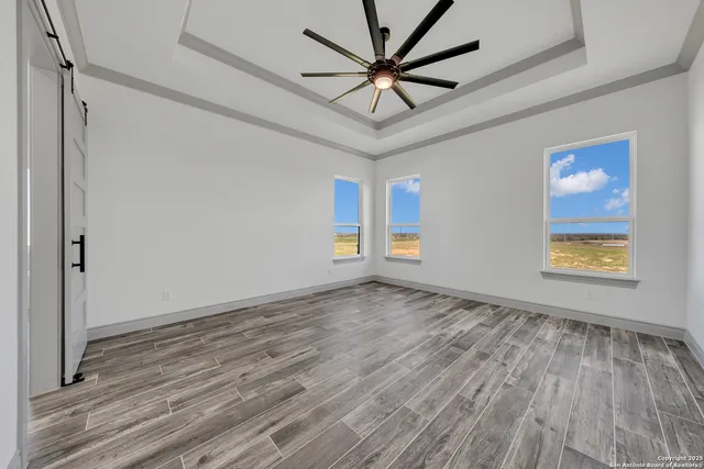 a bathroom with a double vanity sink a mirror and a bathtub