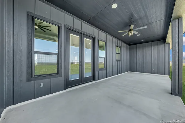 a view of a big yard with an outdoor space and seating area