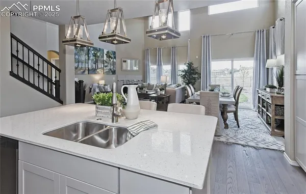 a view of kitchen and dining area with wooden floor