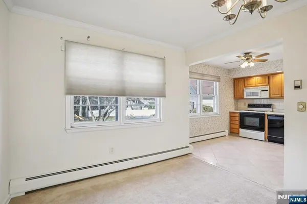 a view of a kitchen with furniture and windows
