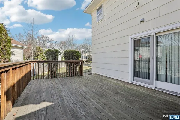 a view of a balcony with wooden floor