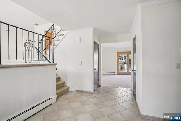 a view of entryway with wooden floor