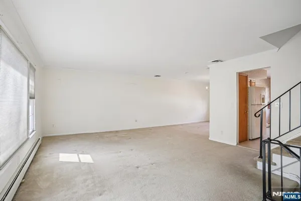 an empty room with staircase