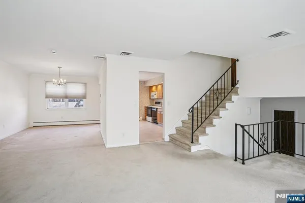 a view of a hallway with staircase