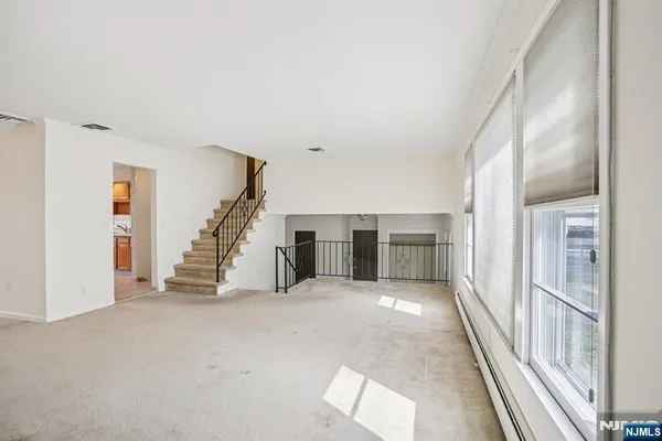 a view of a hallway with staircase