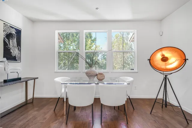 a view of a kitchen with wooden floor