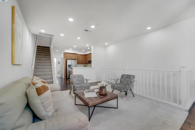a kitchen with a refrigerator and cabinets