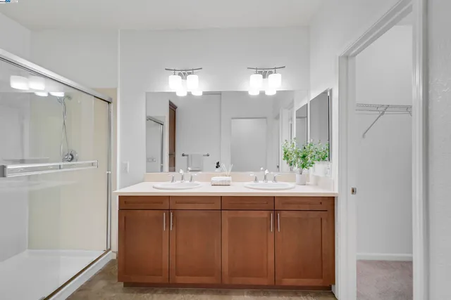 a bedroom with a bed and a lamp