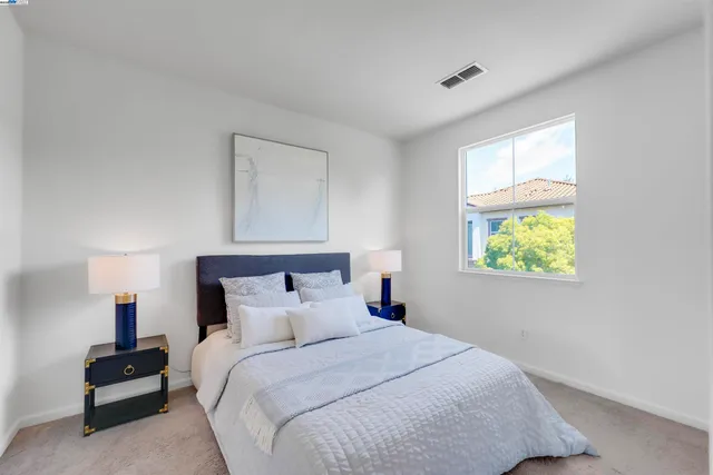 a view of a patio with table and chairs and potted plants
