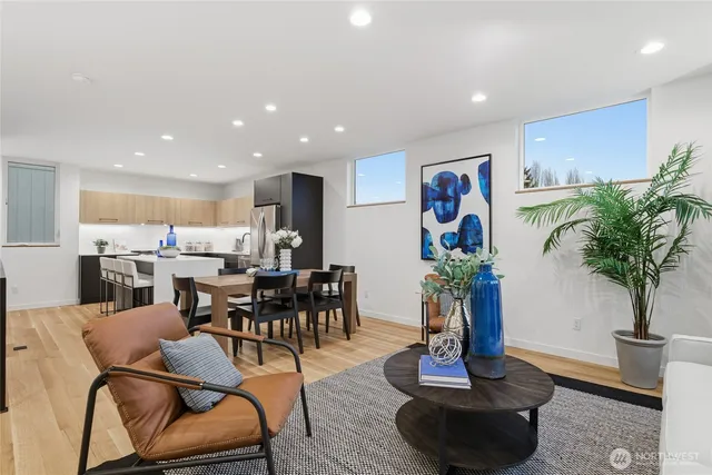 a view of a dining room with furniture and the potted plants