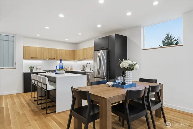 a kitchen with a table and chairs