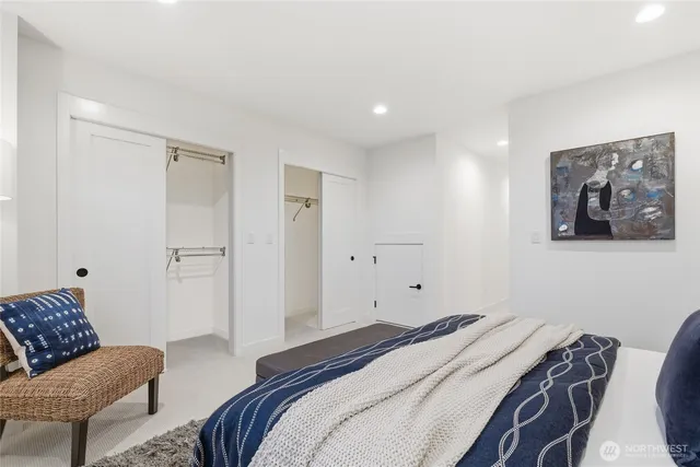 a bedroom with a bed and a couch