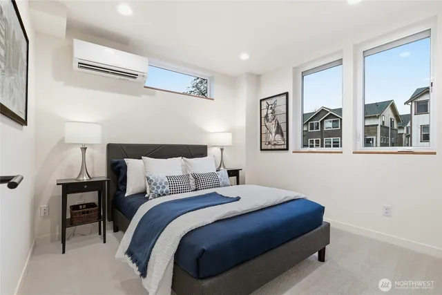 a bedroom with a bed and a night stand