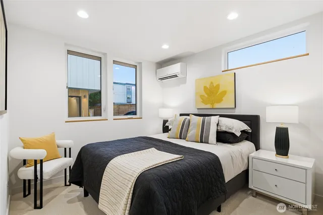 a bedroom with a bed and lamp