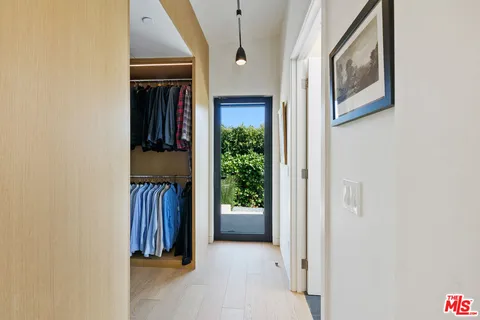 a view of entryway and hall with a yard