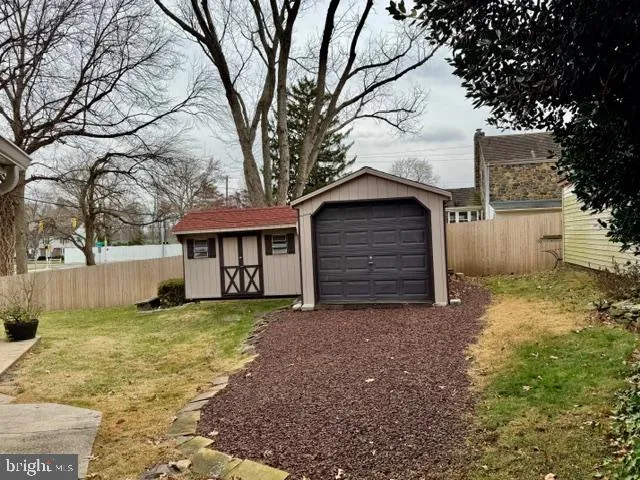 a front view of a house with a yard patio and fire pit