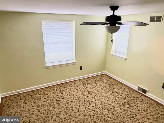 a view of a window in an empty room