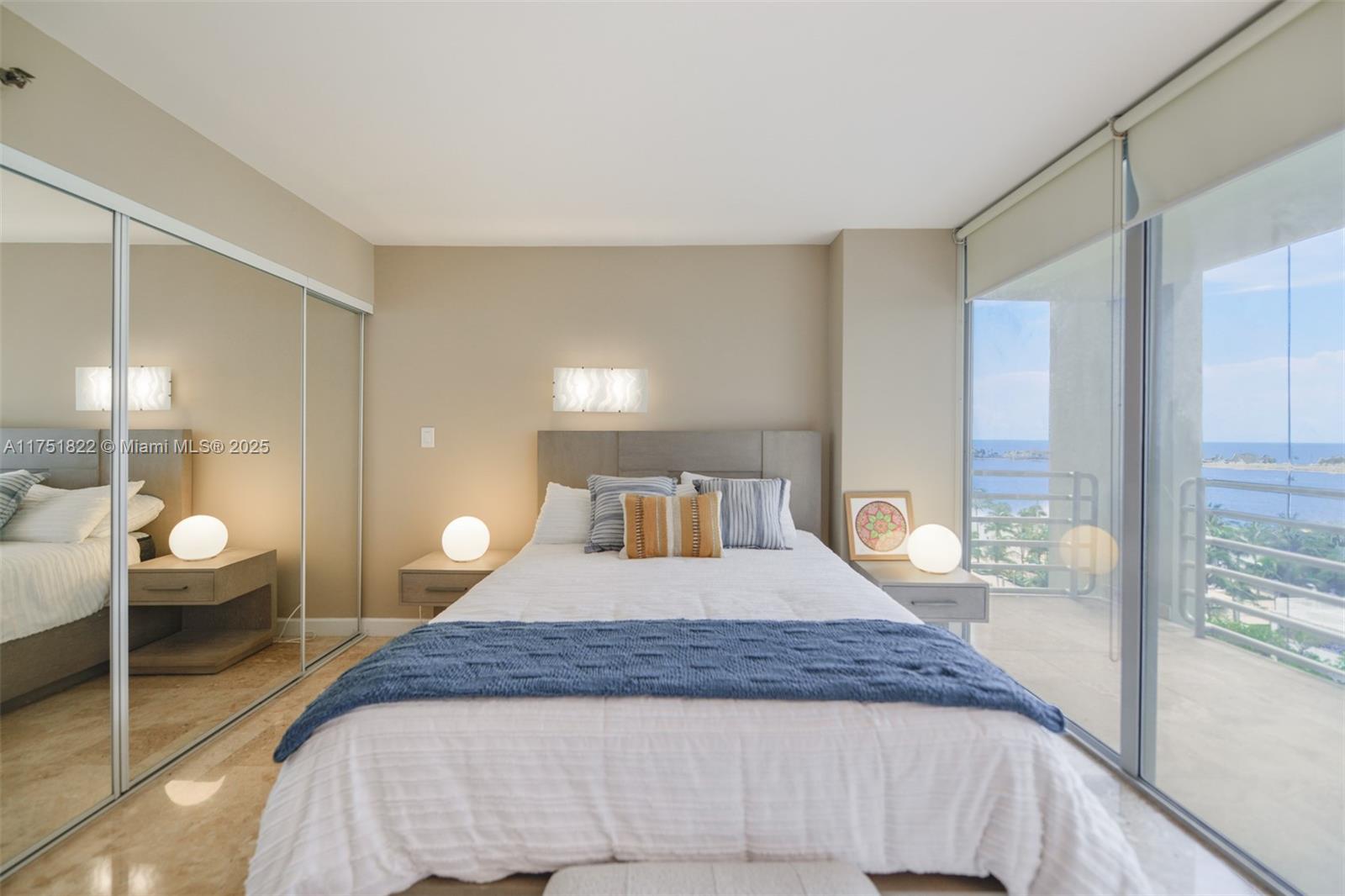 2025 Brickell Avenue, Unit 901 Miami, FL 33129 - Photo 14 of 49 a bedroom with a large bed and a large window