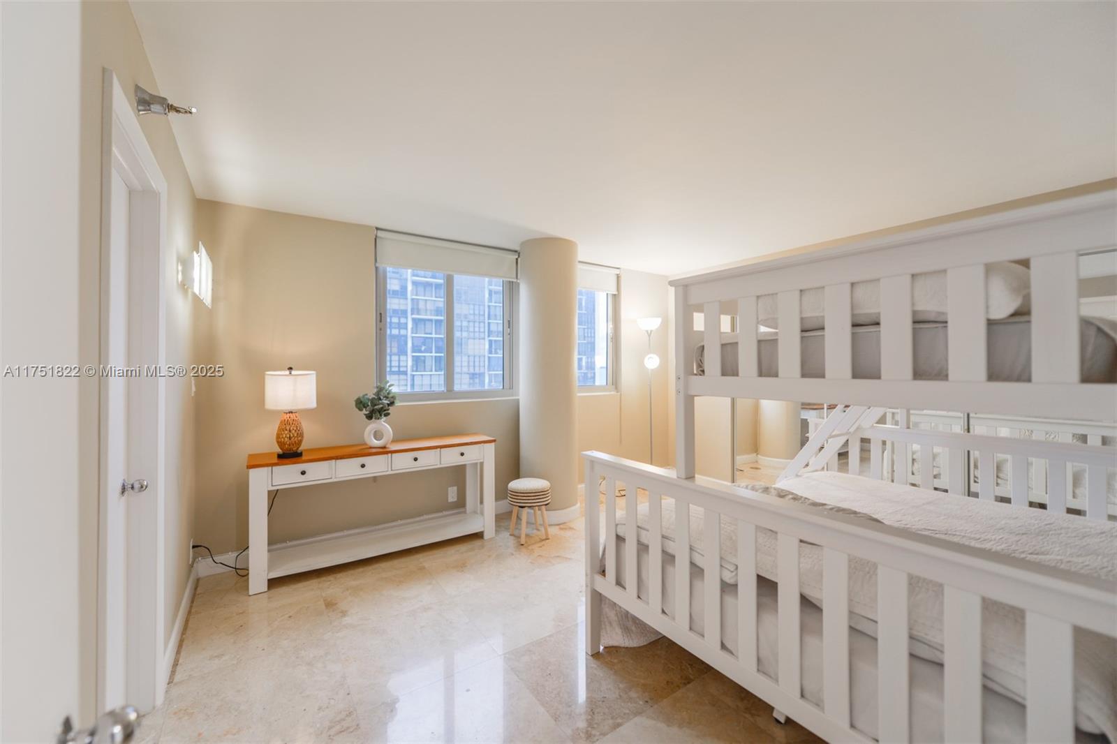 2025 Brickell Avenue, Unit 901 Miami, FL 33129 - Photo 15 of 49 a room with furniture and windows