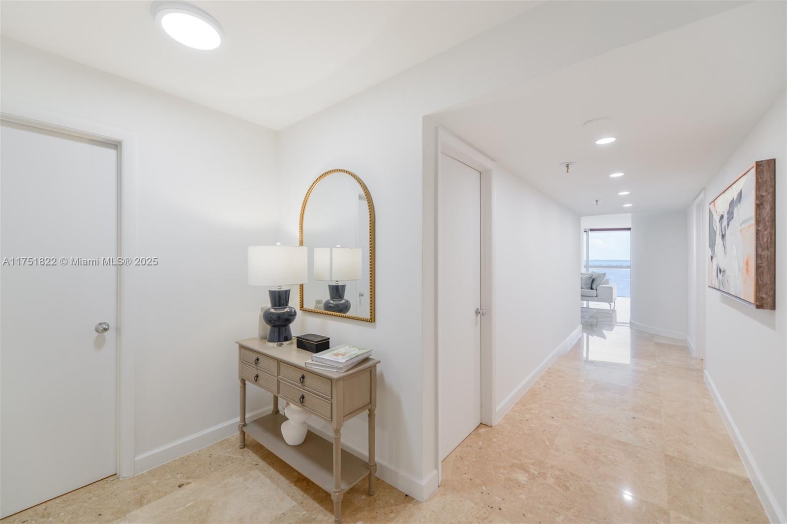 2025 Brickell Avenue, Unit 901 Miami, FL 33129 - Photo 2 of 49 a view of a hallway to a livingroom with furniture