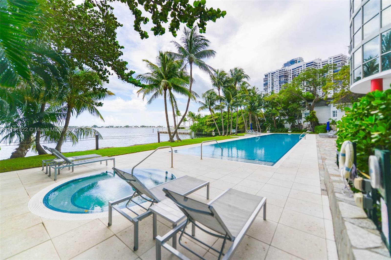 2025 Brickell Avenue, Unit 901 Miami, FL 33129 - Photo 28 of 49 a view of a swimming pool with a patio and a garden