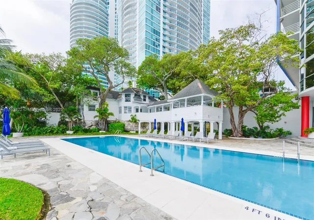 a front view of a house with a garden and pathway