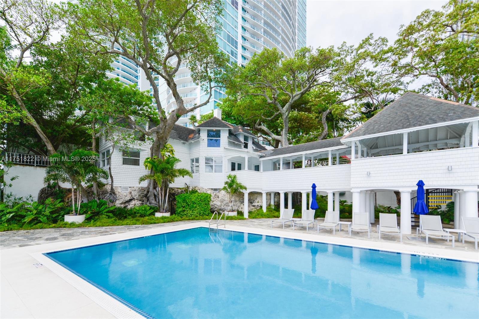 2025 Brickell Avenue, Unit 901 Miami, FL 33129 - Photo 34 of 49 swimming pool view with plants and large trees