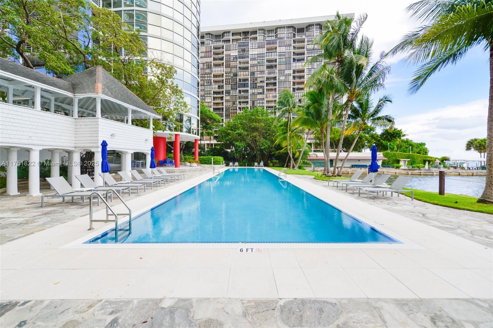 2025 Brickell Avenue, Unit 901 Miami, FL 33129 - Photo 36 of 49 a view of a swimming pool with a lounge chairs