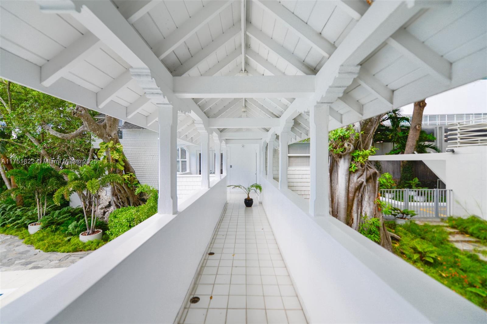 2025 Brickell Avenue, Unit 901 Miami, FL 33129 - Photo 37 of 49 a front view of a house with a garden and pathway