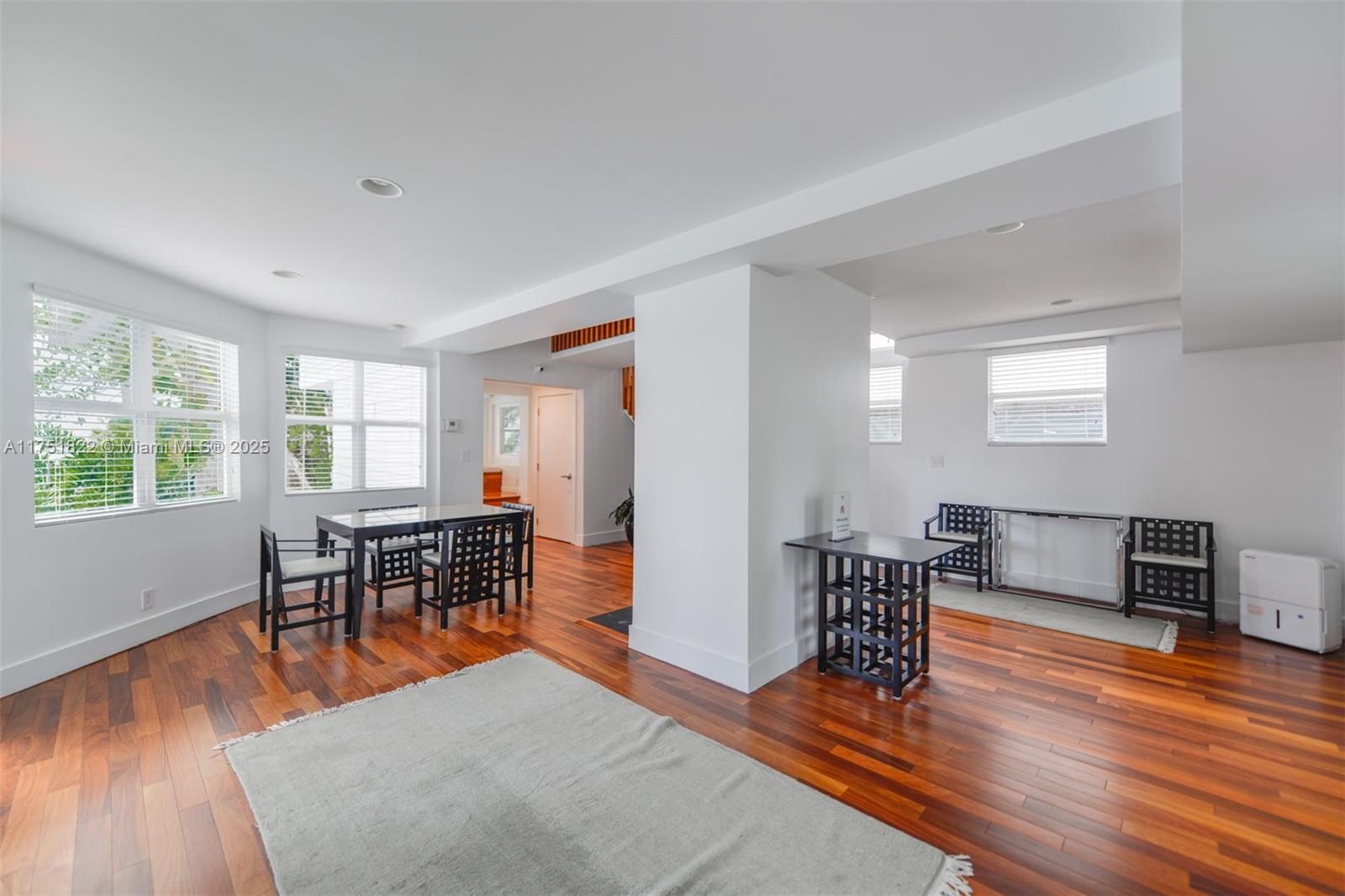 2025 Brickell Avenue, Unit 901 Miami, FL 33129 - Photo 39 of 49 a living room with furniture and a wooden floor