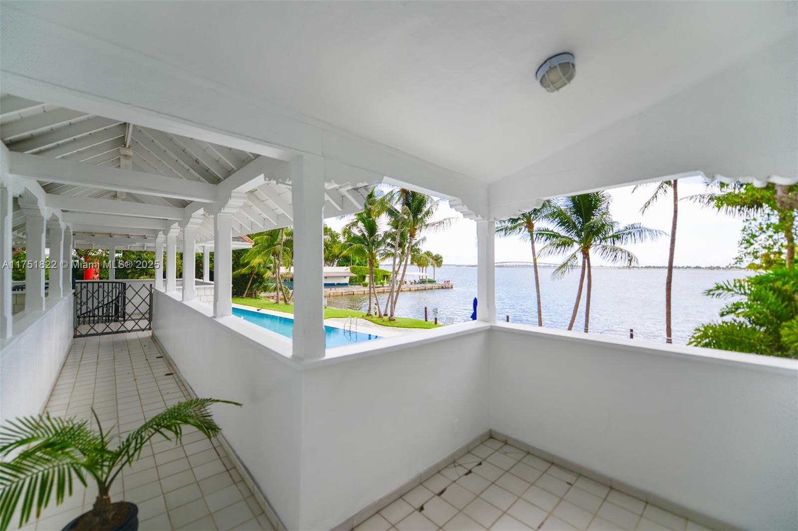 2025 Brickell Avenue, Unit 901 Miami, FL 33129 - Photo 42 of 49 wooden floor in an empty room with a window