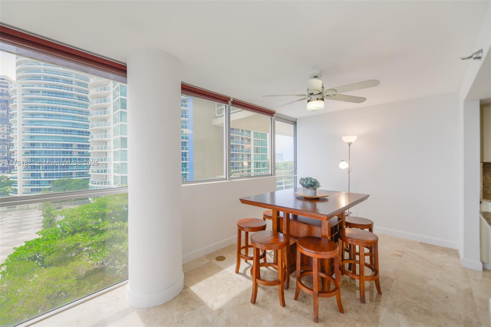 2025 Brickell Avenue, Unit 901 Miami, FL 33129 - Photo 10 of 49 a view of a dining room with furniture and chandelier