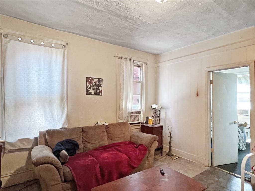 7347 Burton Street Pittsburgh, PA 15218 - Photo 13 of 31 a living room with furniture and a window