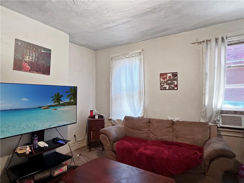 7347 Burton Street Pittsburgh, PA 15218 - Photo 14 of 31 a living room with furniture and a window