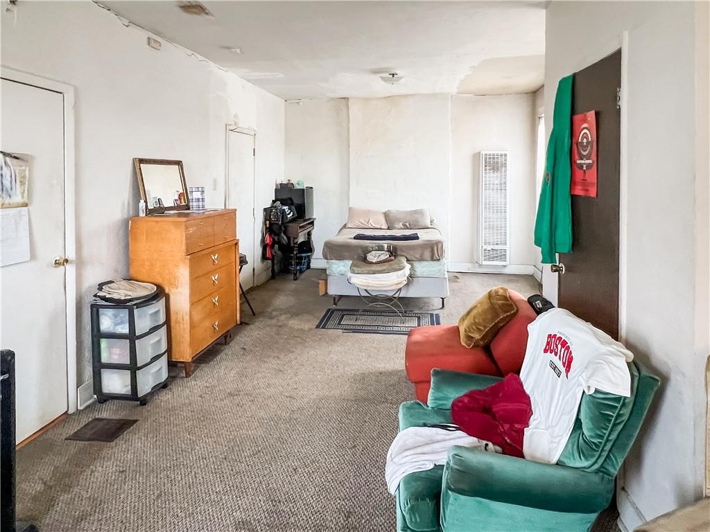 7347 Burton Street Pittsburgh, PA 15218 - Photo 20 of 31 a living room with furniture window and a flat screen tv